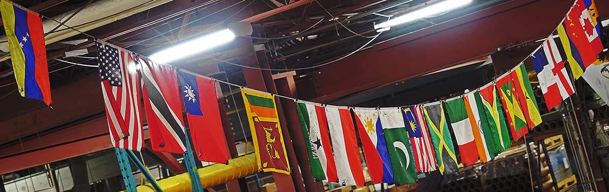 A line of national flags strung across the Celplast plant floor in Toronto